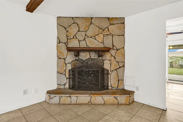 a view of an empty room and window chandelier fan