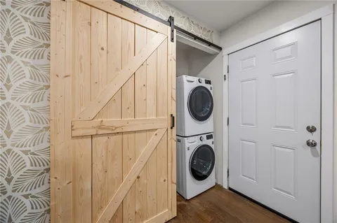 a view of a hallway with washer and dryer
