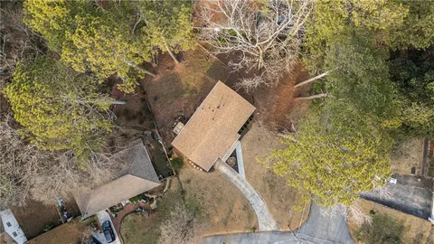 an aerial view of a house with outdoor space