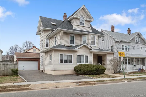 a front view of a house with a porch