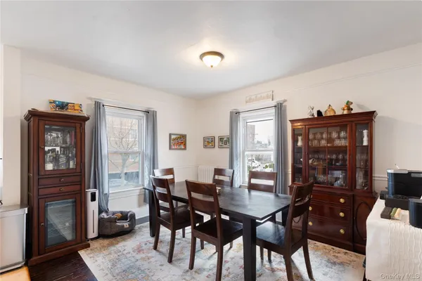 a view of a dining room with furniture and window