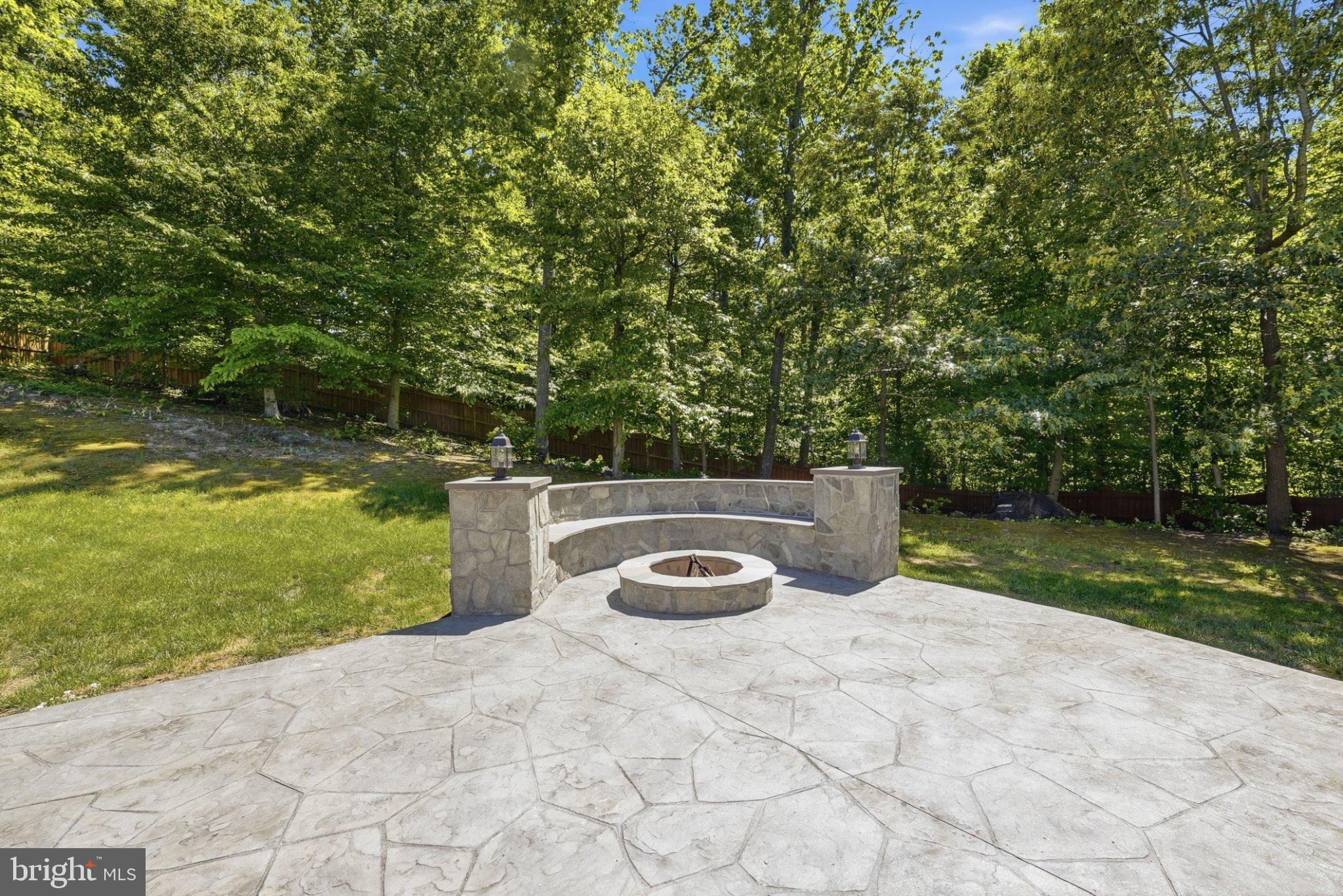 3679 Expedition Drive Triangle, VA 22172 - Photo 3 of 65 Serene fire pit nestled in nature.