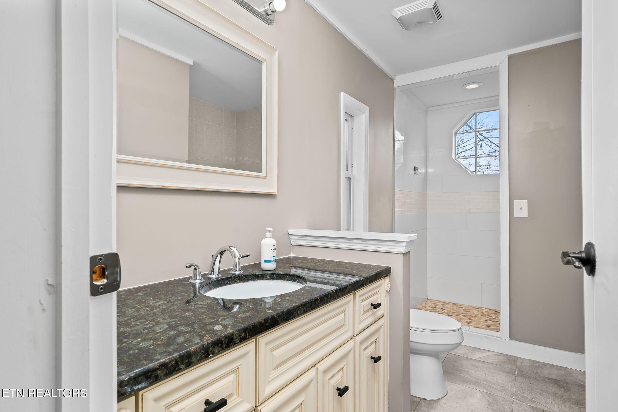 219 North Lowe Road Crossville, TN 38571 - Photo 26 of 34 a bathroom with a granite countertop sink toilet and shower