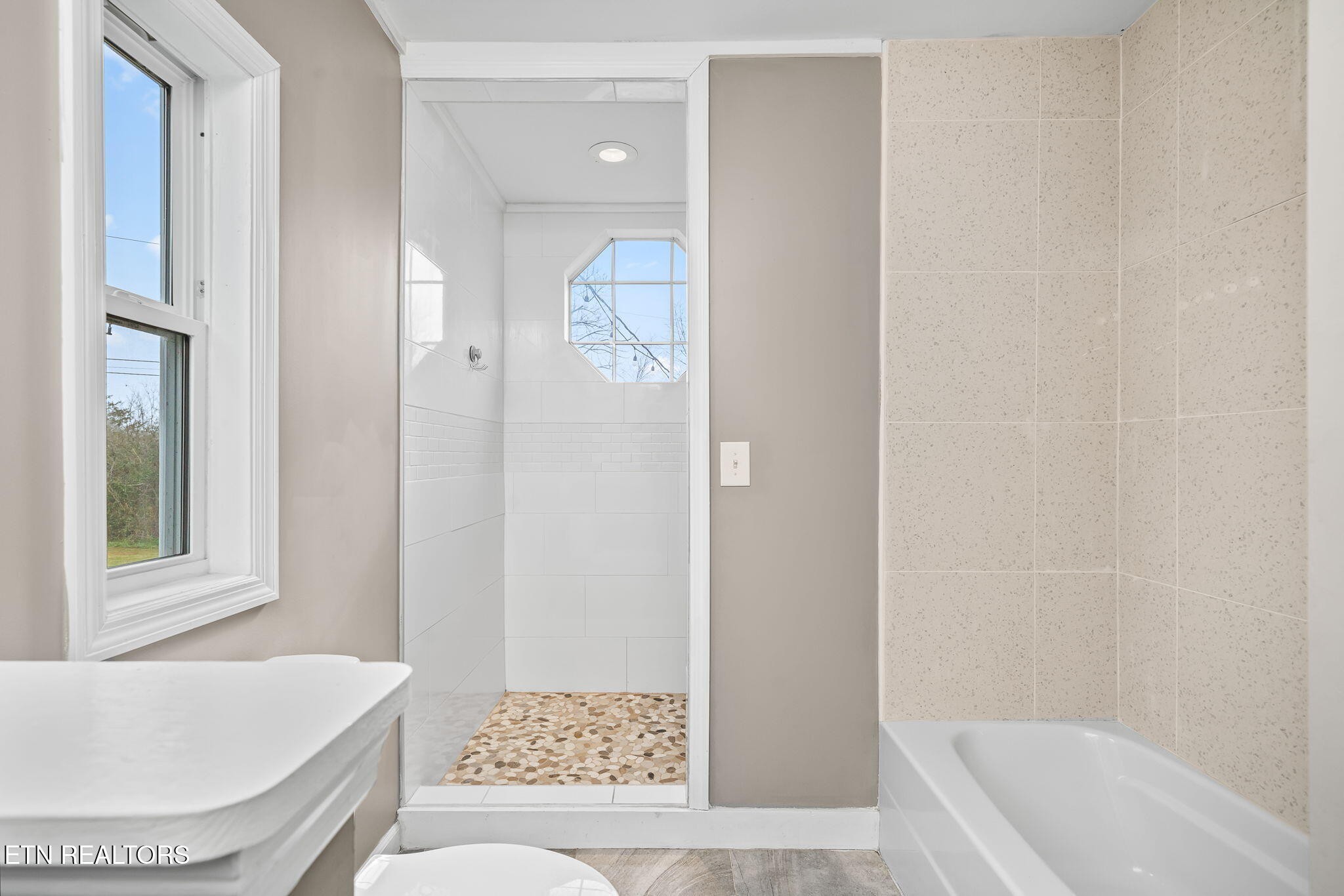 219 North Lowe Road Crossville, TN 38571 - Photo 27 of 34 a bathroom with a tub shower and a sink