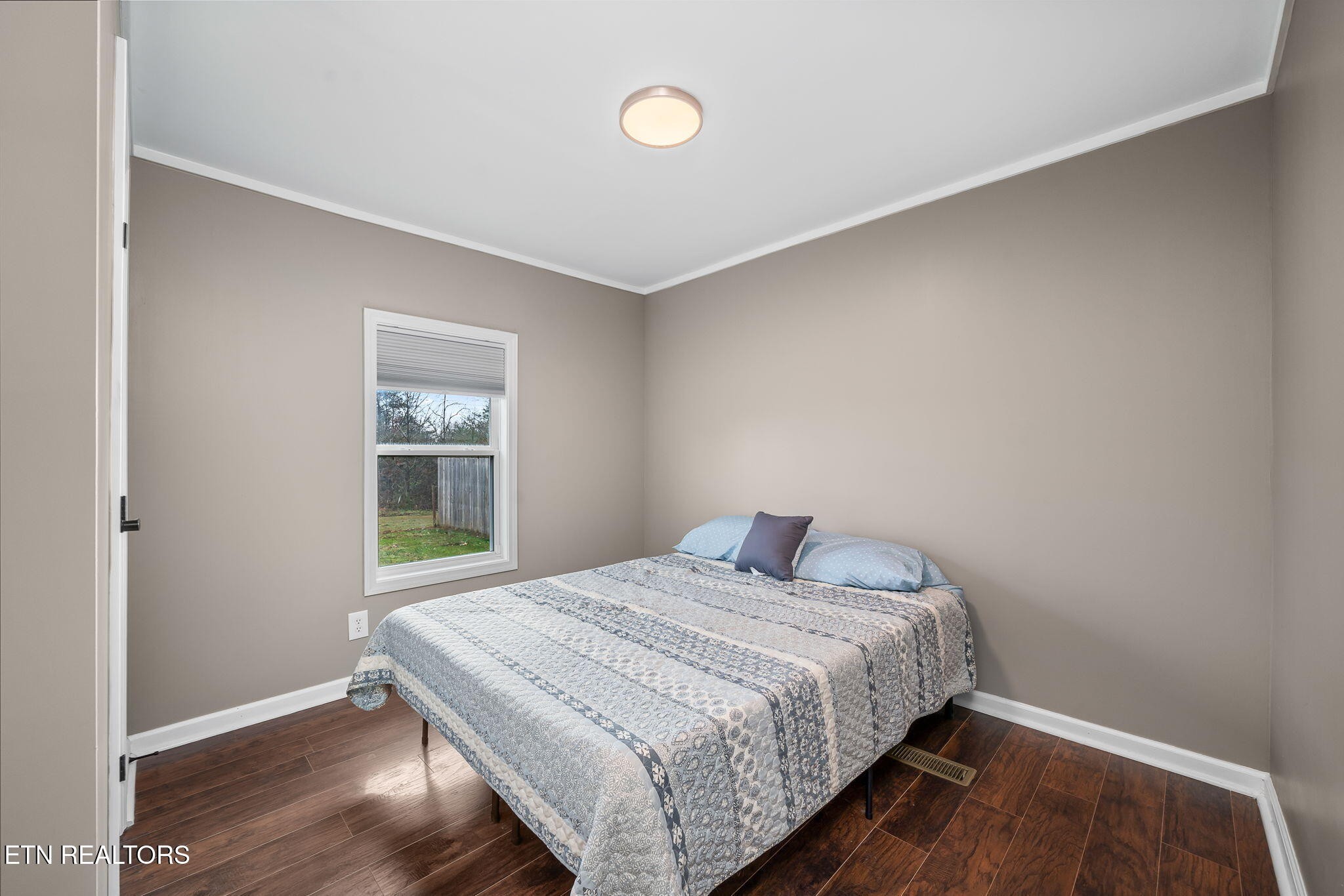 219 North Lowe Road Crossville, TN 38571 - Photo 32 of 34 a bedroom with a bed and a window