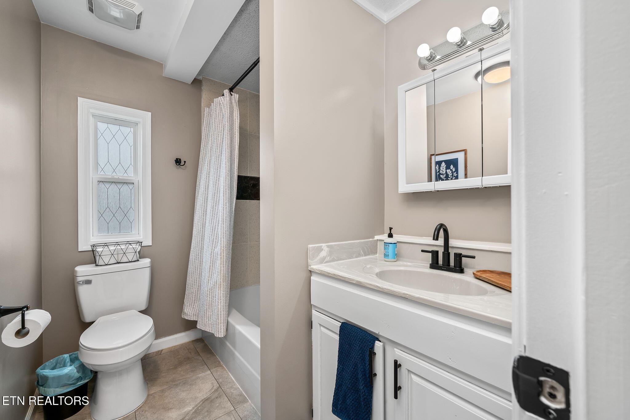 219 North Lowe Road Crossville, TN 38571 - Photo 33 of 34 a bathroom with a sink toilet vanity and mirror