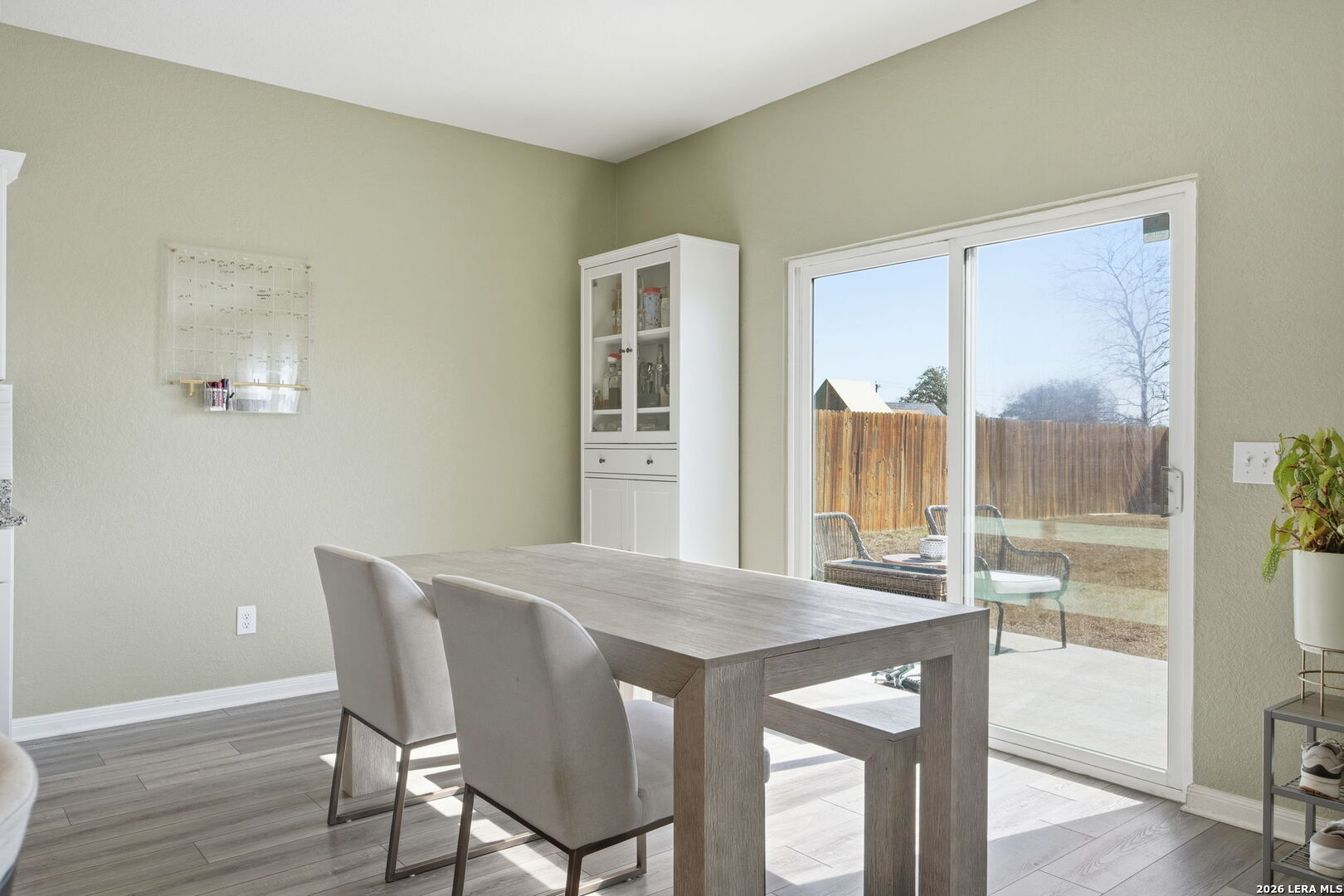5496 Rue Girard Converse, TX 78109 - Photo 13 of 40 a view of a dining room with furniture and wooden floor