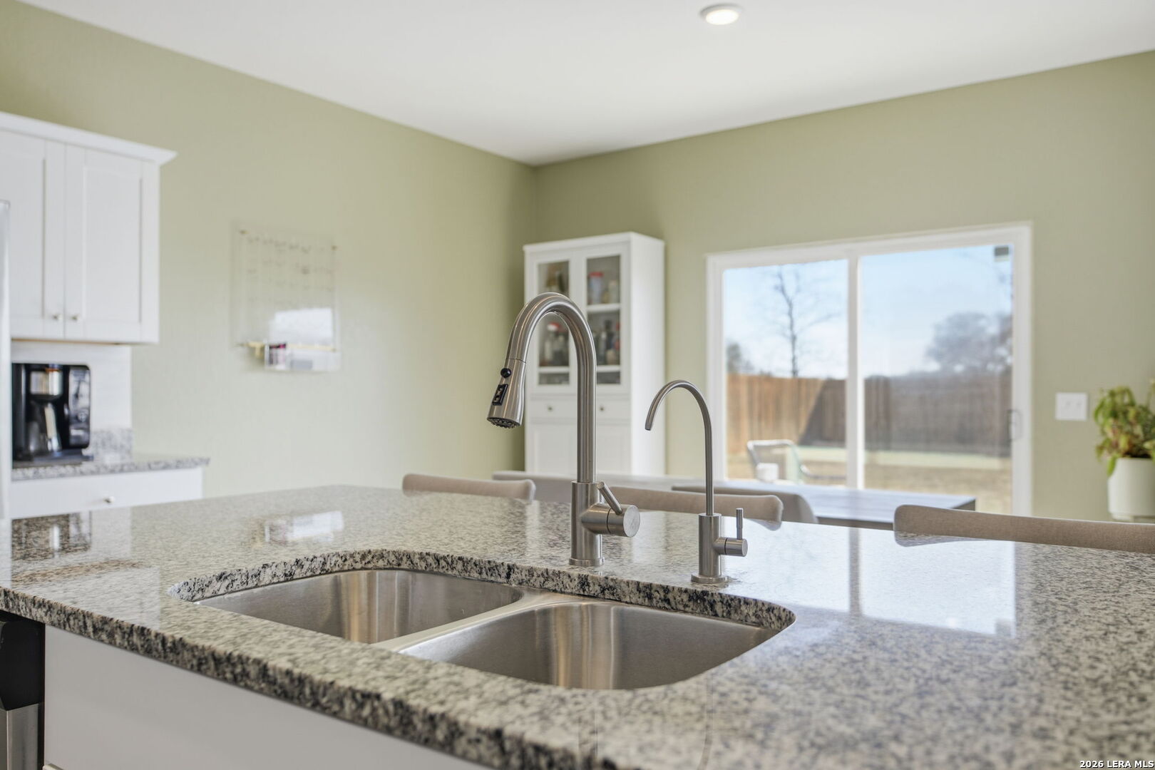 5496 Rue Girard Converse, TX 78109 - Photo 16 of 40 a kitchen with granite countertop a sink and a granite counter tops