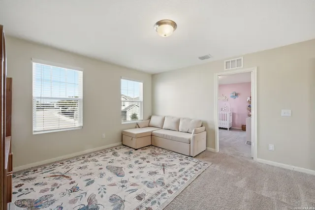 a living room with furniture and window