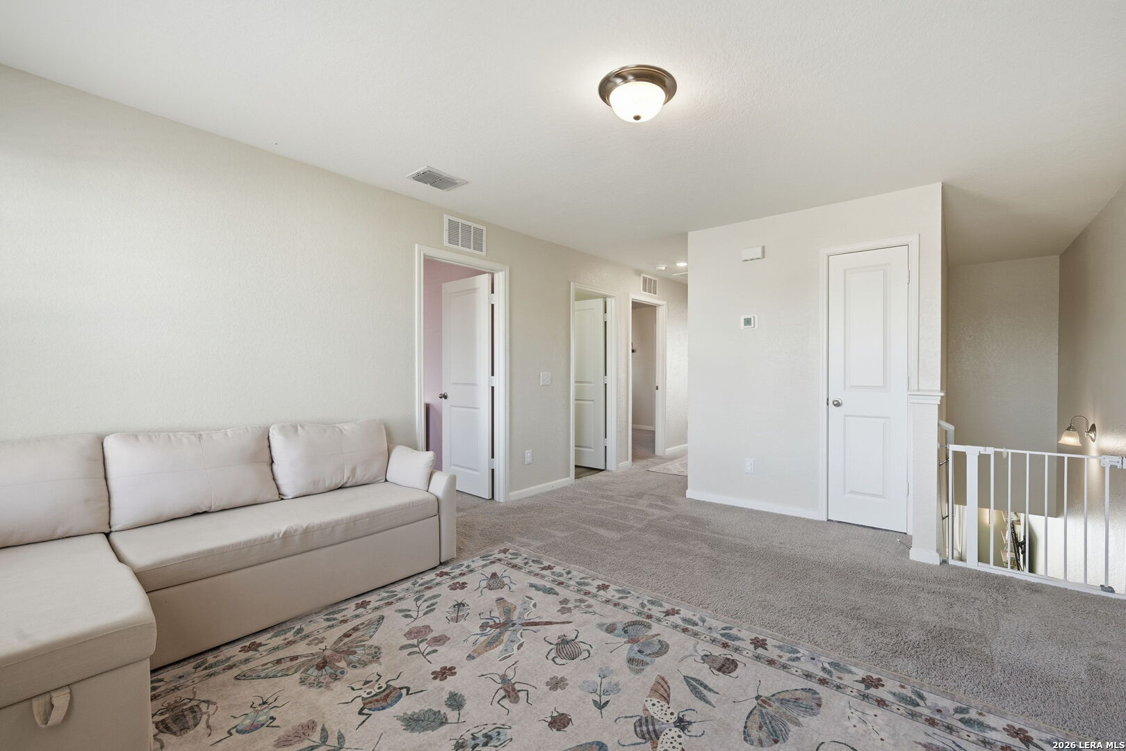 5496 Rue Girard Converse, TX 78109 - Photo 19 of 40 a living room with a couch and a rug