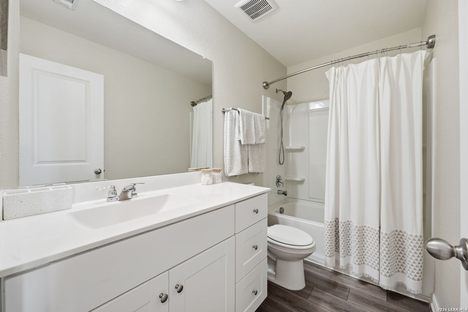 5496 Rue Girard Converse, TX 78109 - Photo 22 of 40 a bathroom with a sink toilet a shower and a mirror