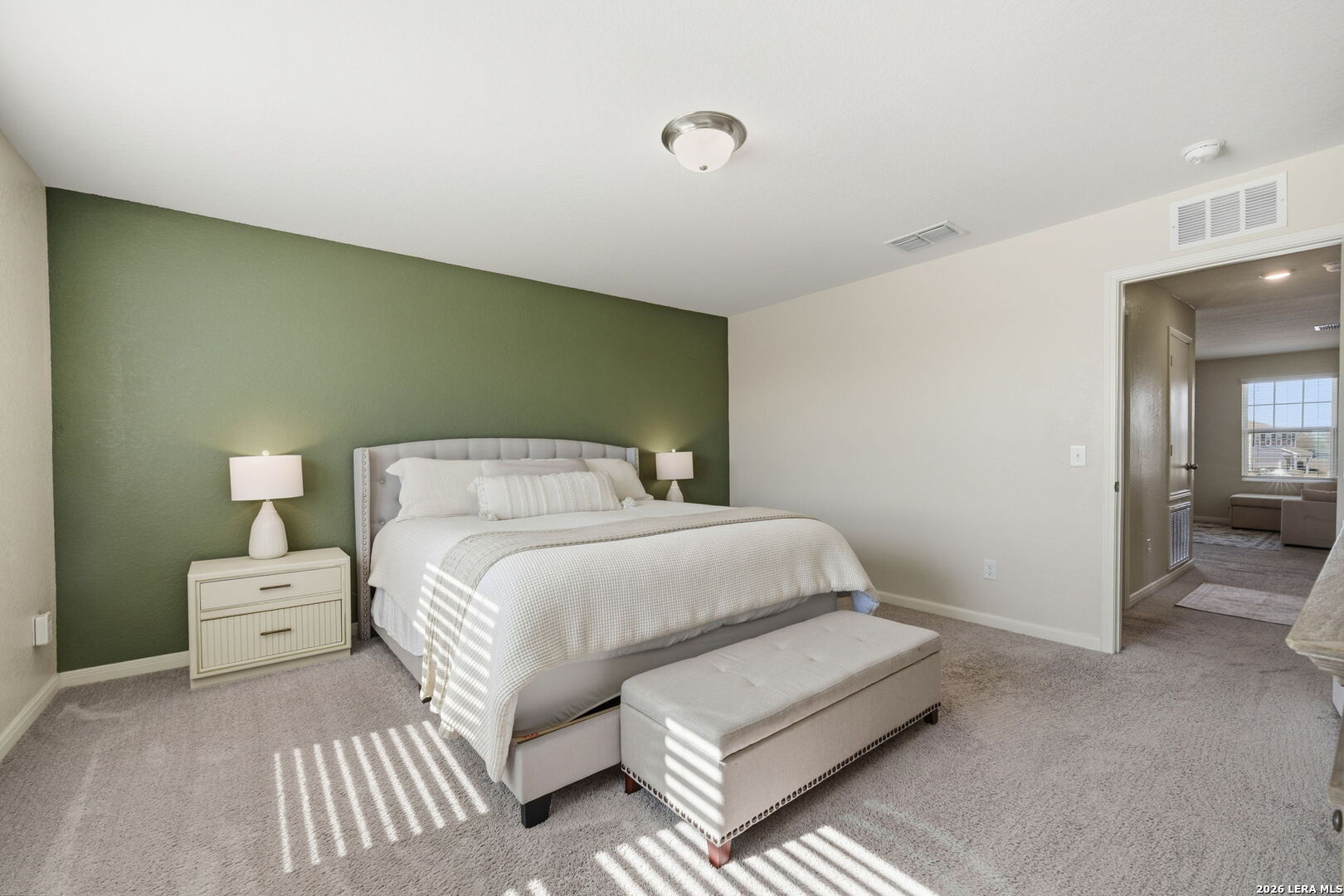 5496 Rue Girard Converse, TX 78109 - Photo 26 of 40 a bedroom with a bed and a lamp