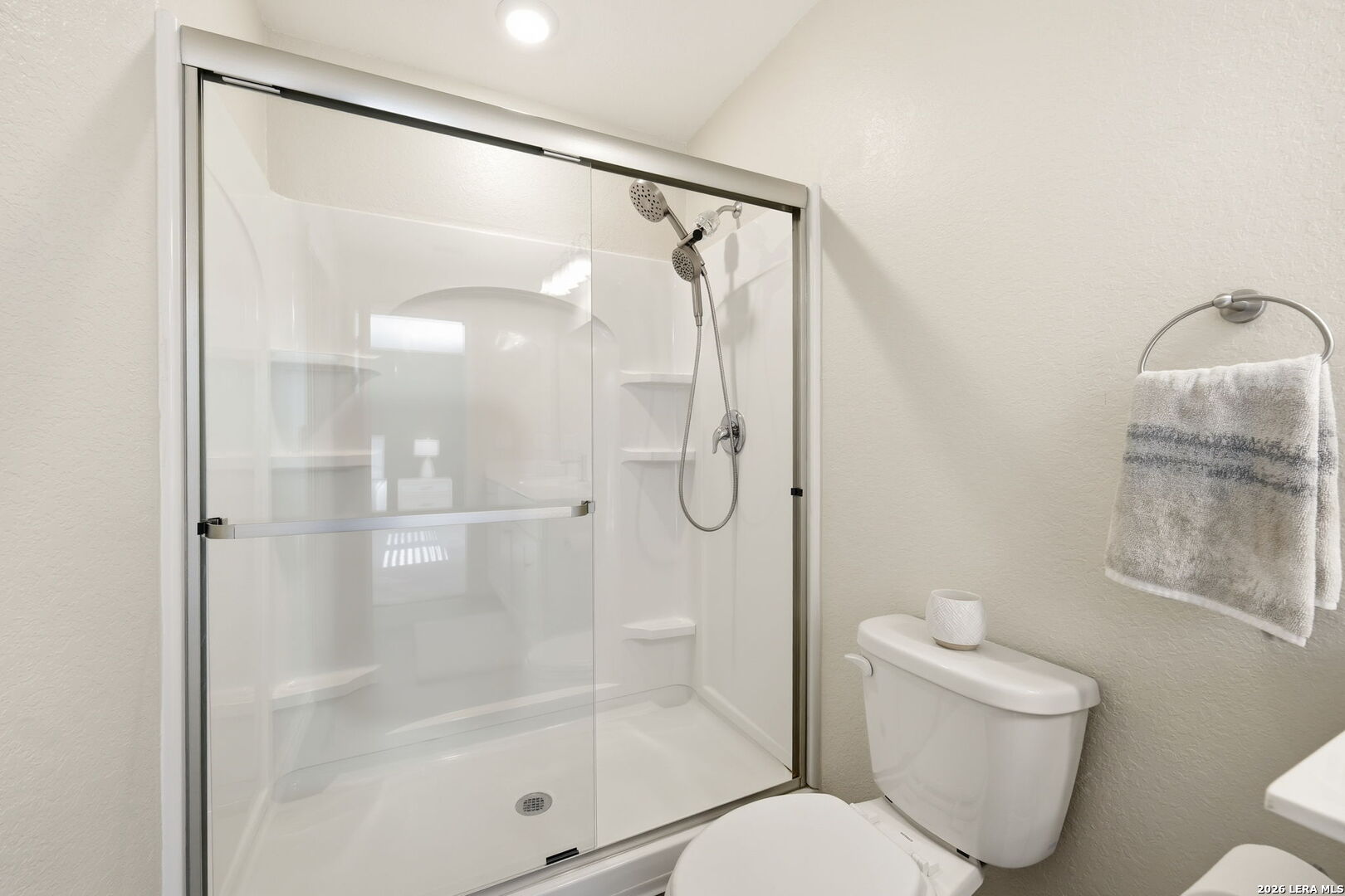 5496 Rue Girard Converse, TX 78109 - Photo 28 of 40 a bathroom with a shower a toilet and a shower