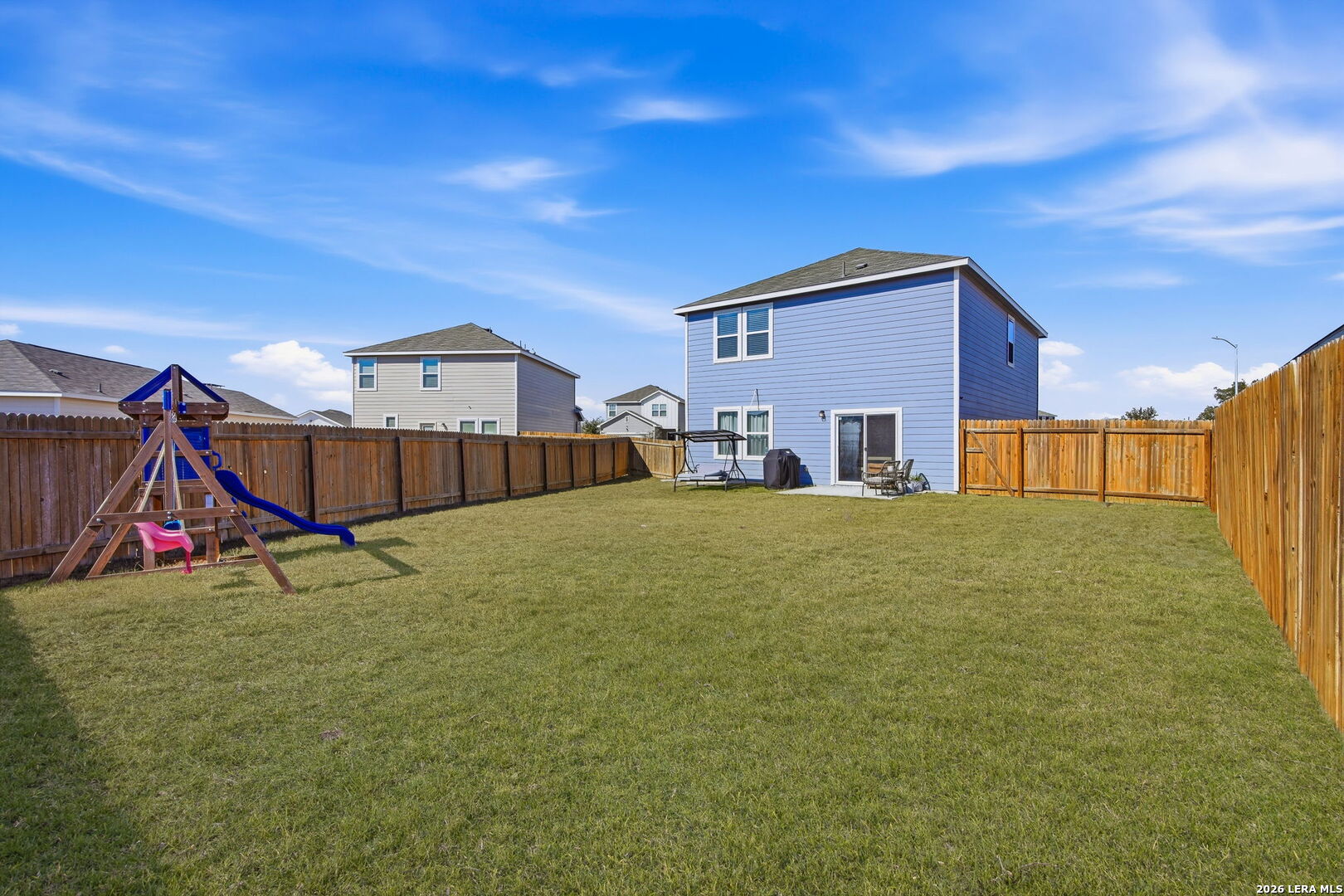5496 Rue Girard Converse, TX 78109 - Photo 32 of 40 a house view with a backyard