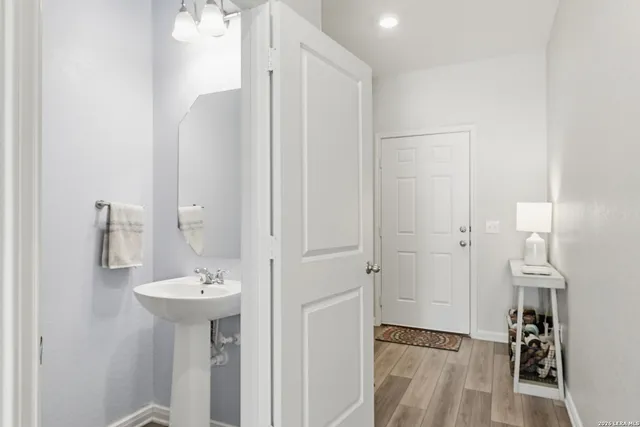 a bathroom with a sink and mirror