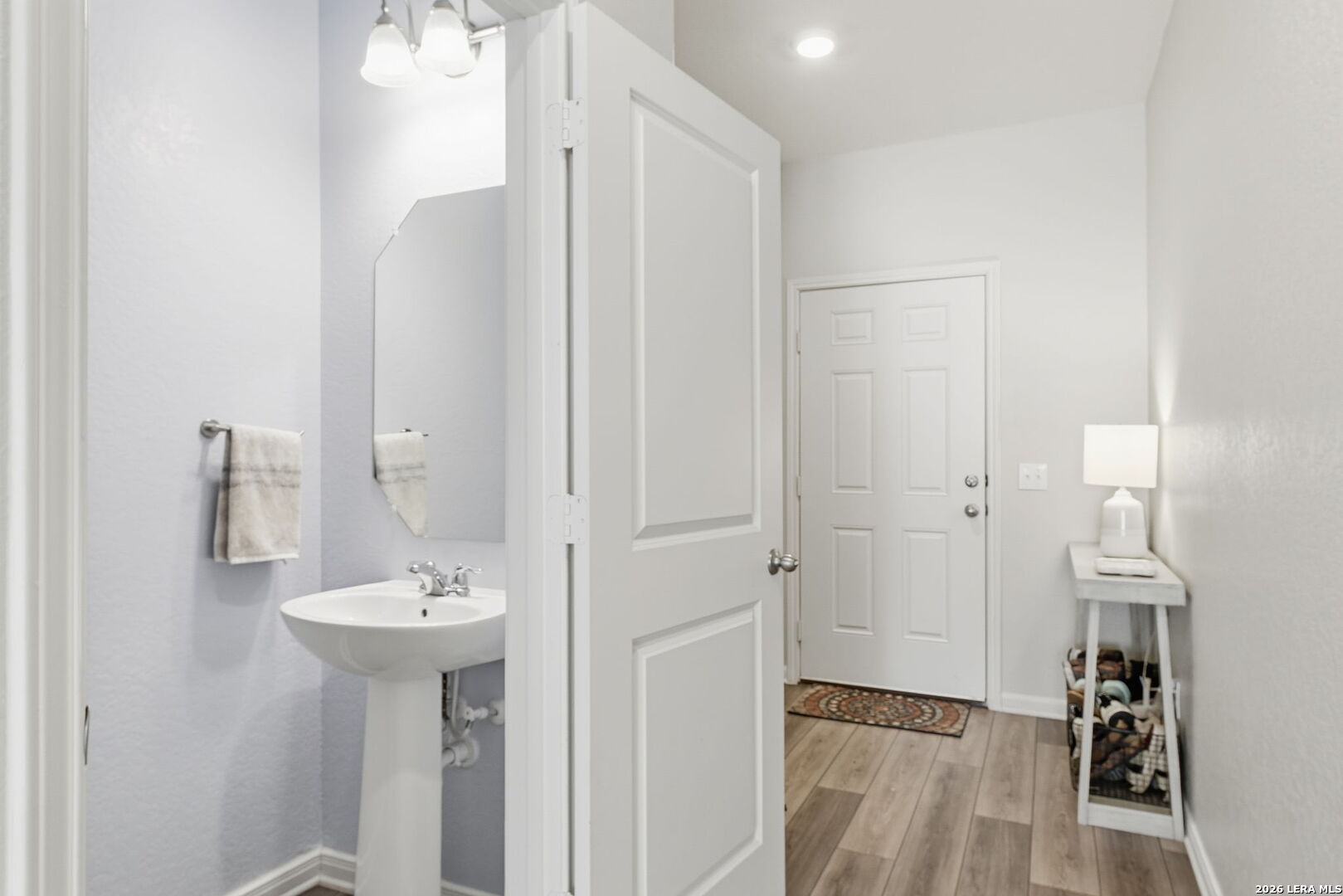 5496 Rue Girard Converse, TX 78109 - Photo 6 of 40 a bathroom with a sink and mirror