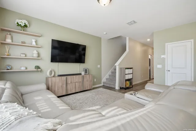 a living room with a couch and a flat screen tv
