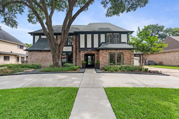 a front view of a house with yard