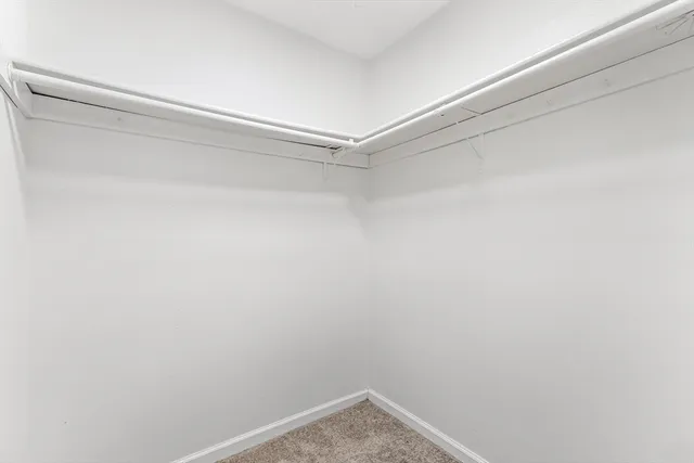 a view of a room with shelf on the wall