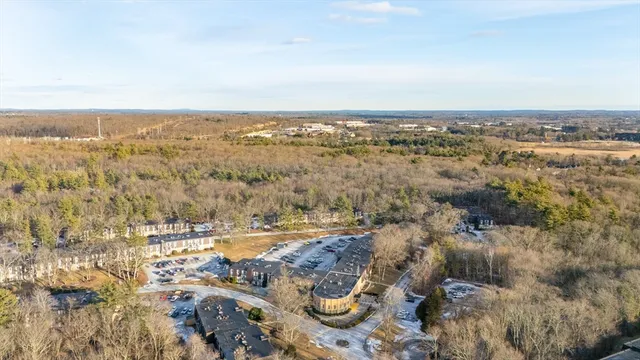 an aerial view of residential building and ocean