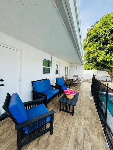 a living room with furniture and a rug
