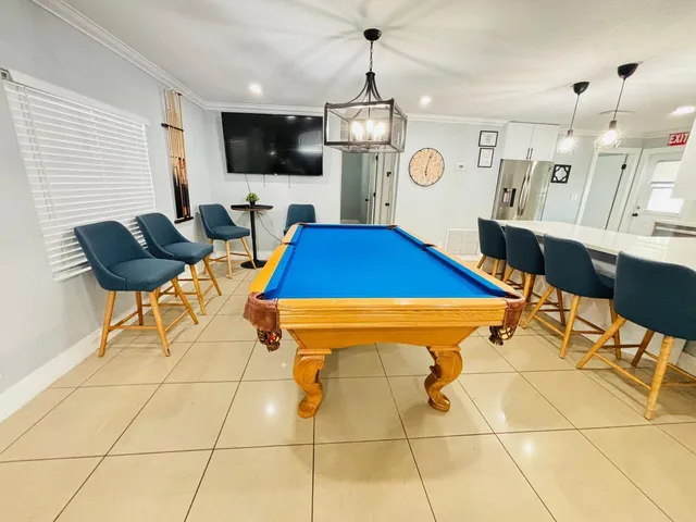 a room with lots of furniture and flat screen tv