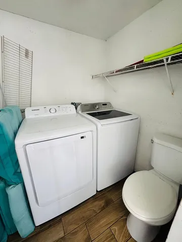 a utility room with dryer and washer