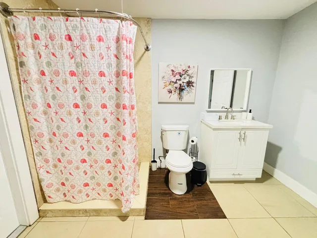 a bathroom with a toilet and a sink