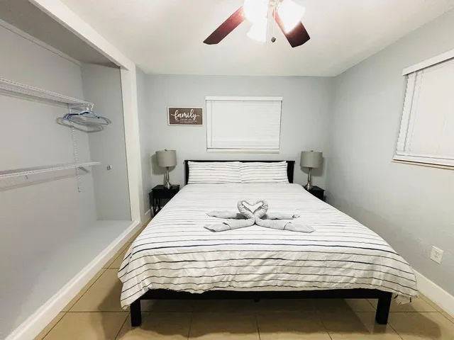 a bedroom with a bed and window