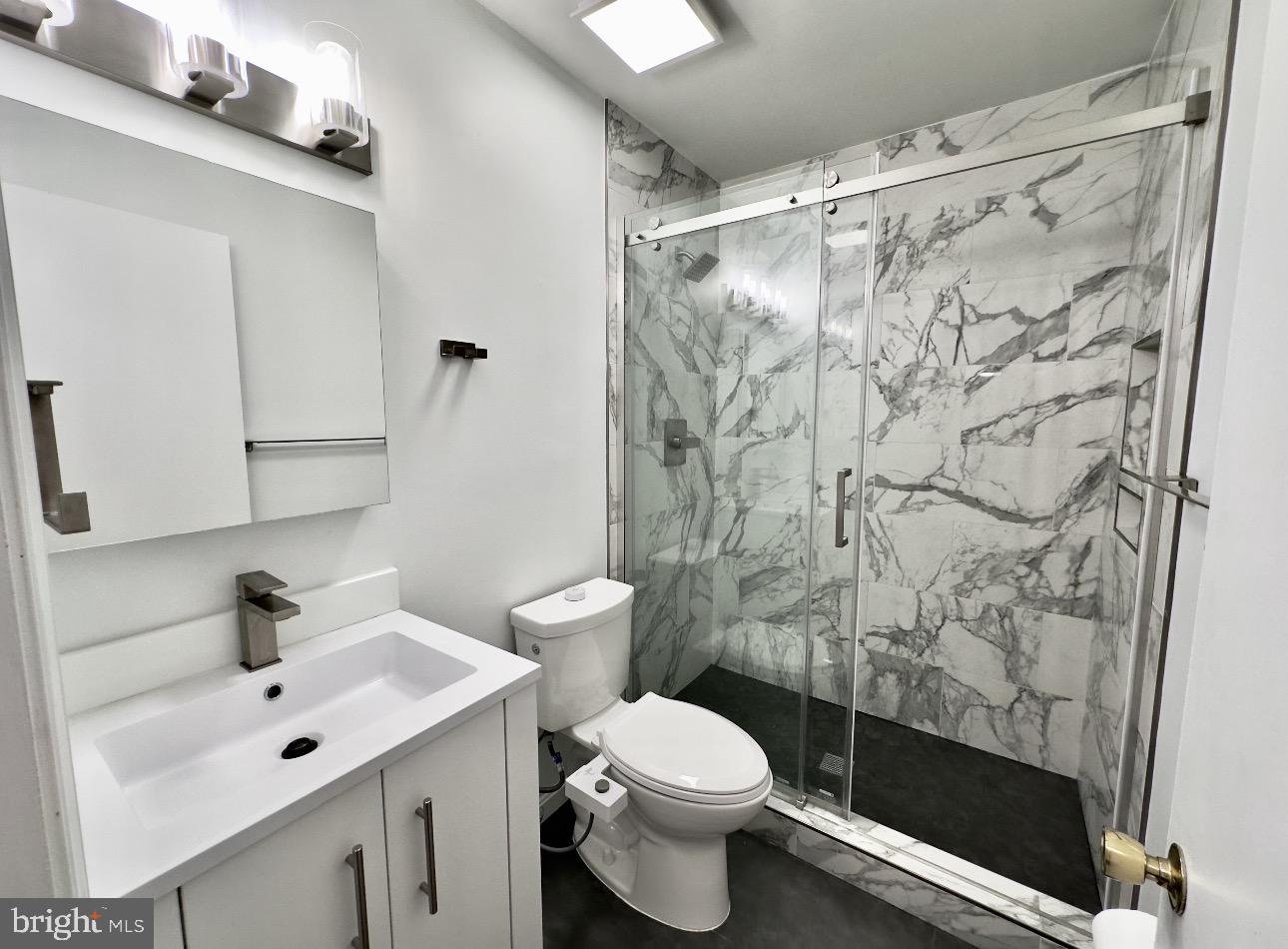 4203 Main Street Alexandria, VA 22309 - Photo 5 of 6 a bathroom with a sink and a mirror