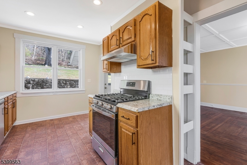 16 Tisco Avenue High Bridge, NJ 08829 - Photo 11 of 28 a kitchen with stainless steel appliances granite countertop a stove and a refrigerator