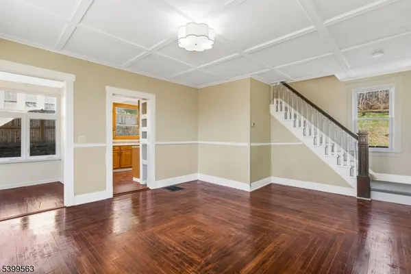 a view of an entryway with wooden floor