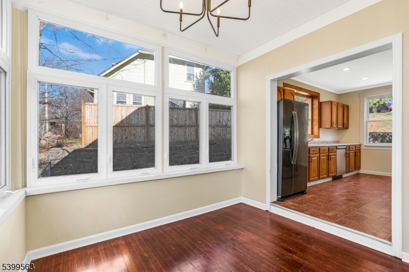 16 Tisco Avenue High Bridge, NJ 08829 - Photo 5 of 28 a view of a large room with wooden floor and a kitchen