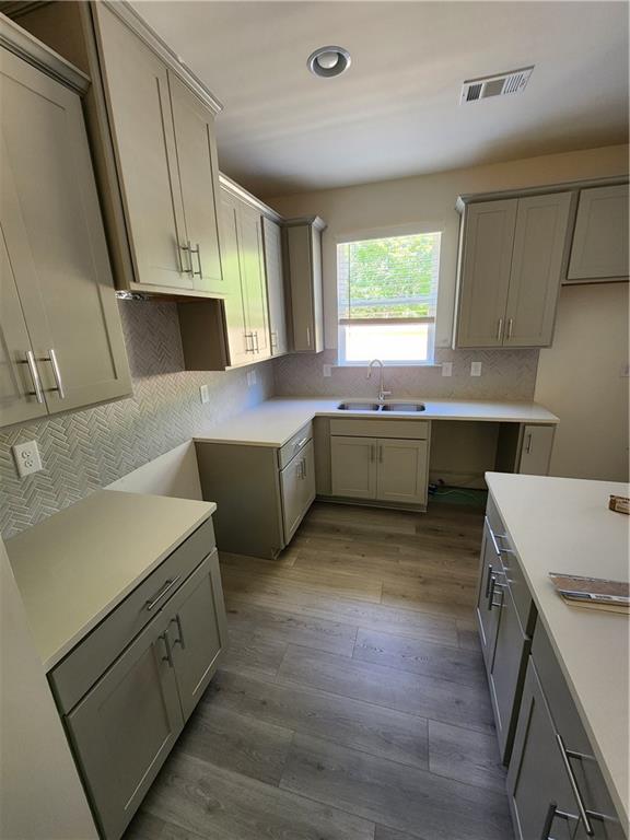 4237 Spring Valley Circle Tucker, GA 30084 - Photo 4 of 7 a kitchen with a sink stove and cabinets