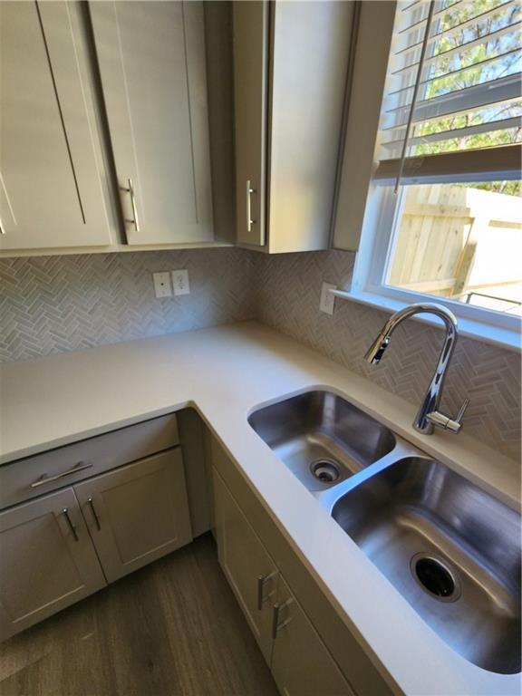 4237 Spring Valley Circle Tucker, GA 30084 - Photo 5 of 7 a kitchen with a sink cabinets and a wooden floor
