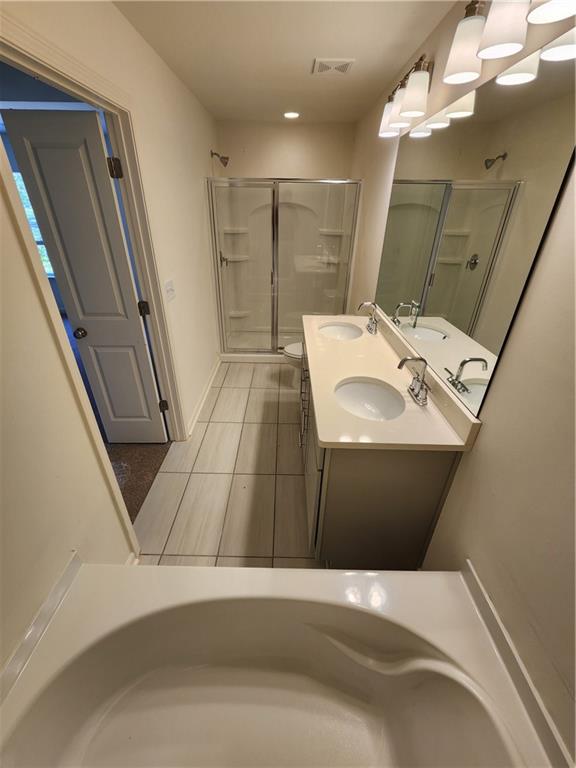 4237 Spring Valley Circle Tucker, GA 30084 - Photo 6 of 7 a bathroom with a sink and mirror