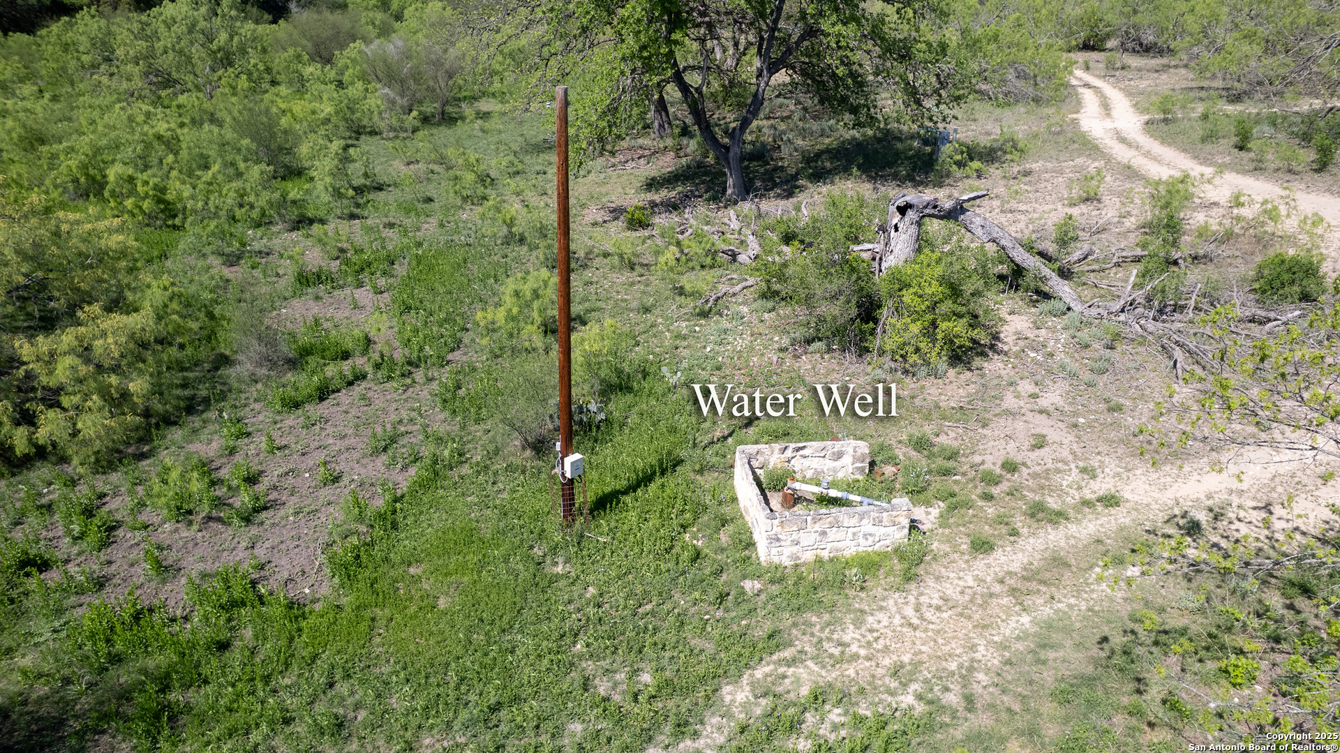 22 Camino Del Rancho Concan, TX 78838 - Photo 4 of 16 a aerial view of a house with a yard