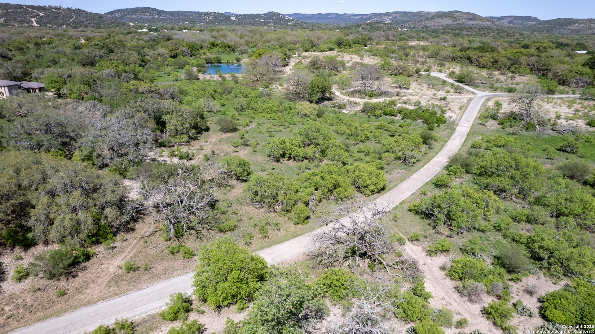 22 Camino Del Rancho Concan, TX 78838 - Photo 5 of 16 an aerial view of mountains residential house and green space