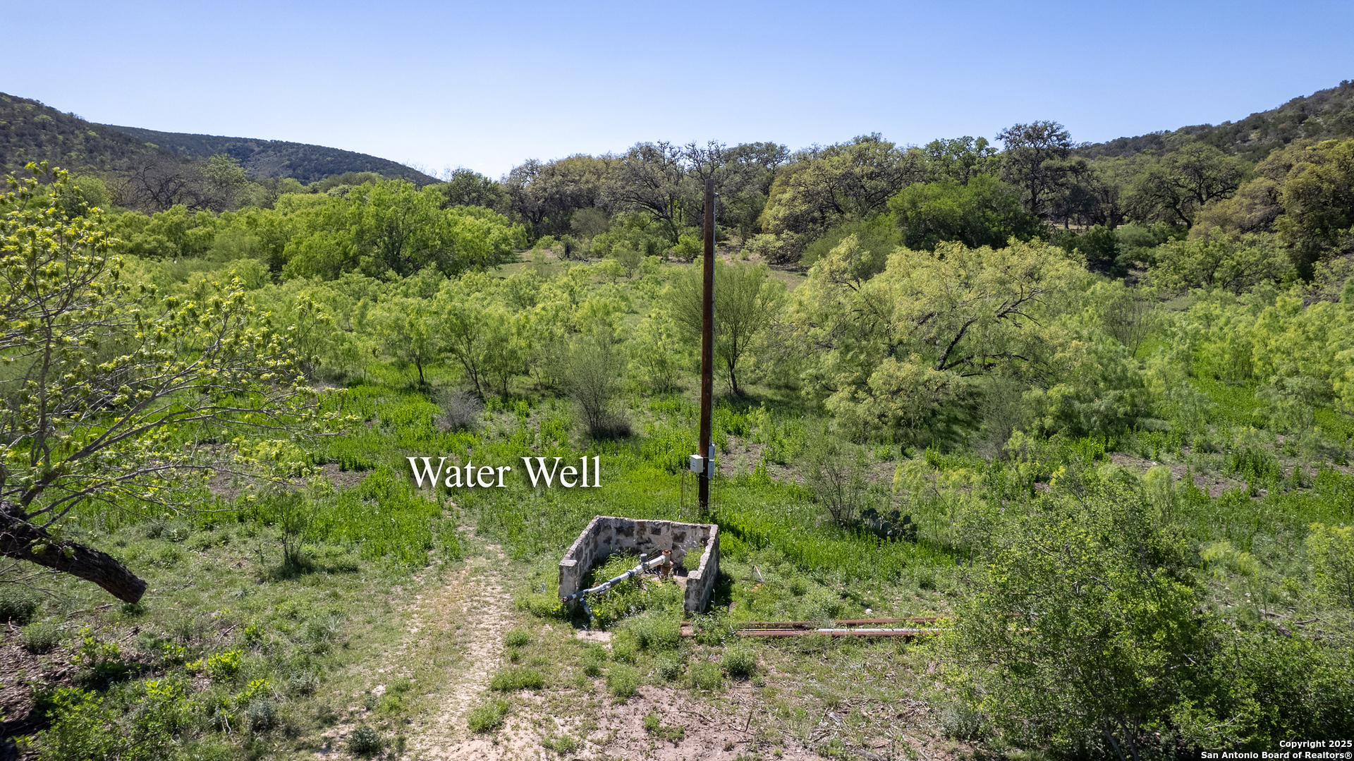 22 Camino Del Rancho Concan, TX 78838 - Photo 6 of 16 a green field with lots of bushes