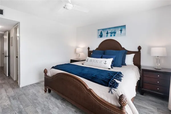 a bedroom with a bed and a lamp