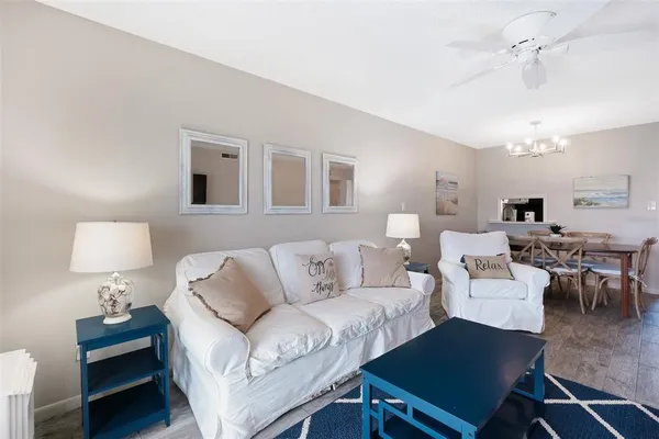 a living room with furniture and a lamp