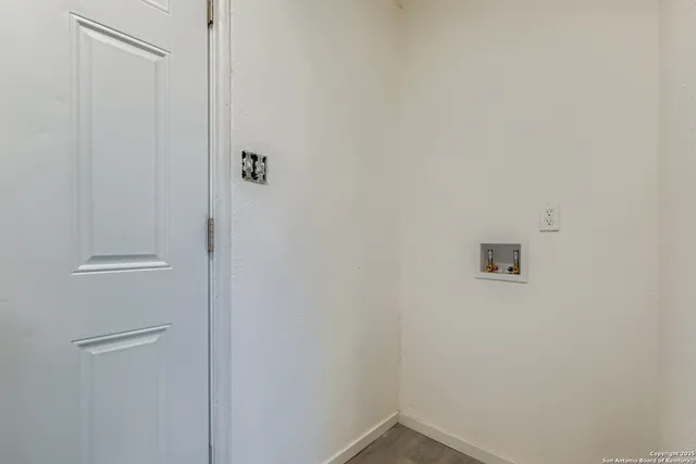 a view of backyard with deck and wooden fence