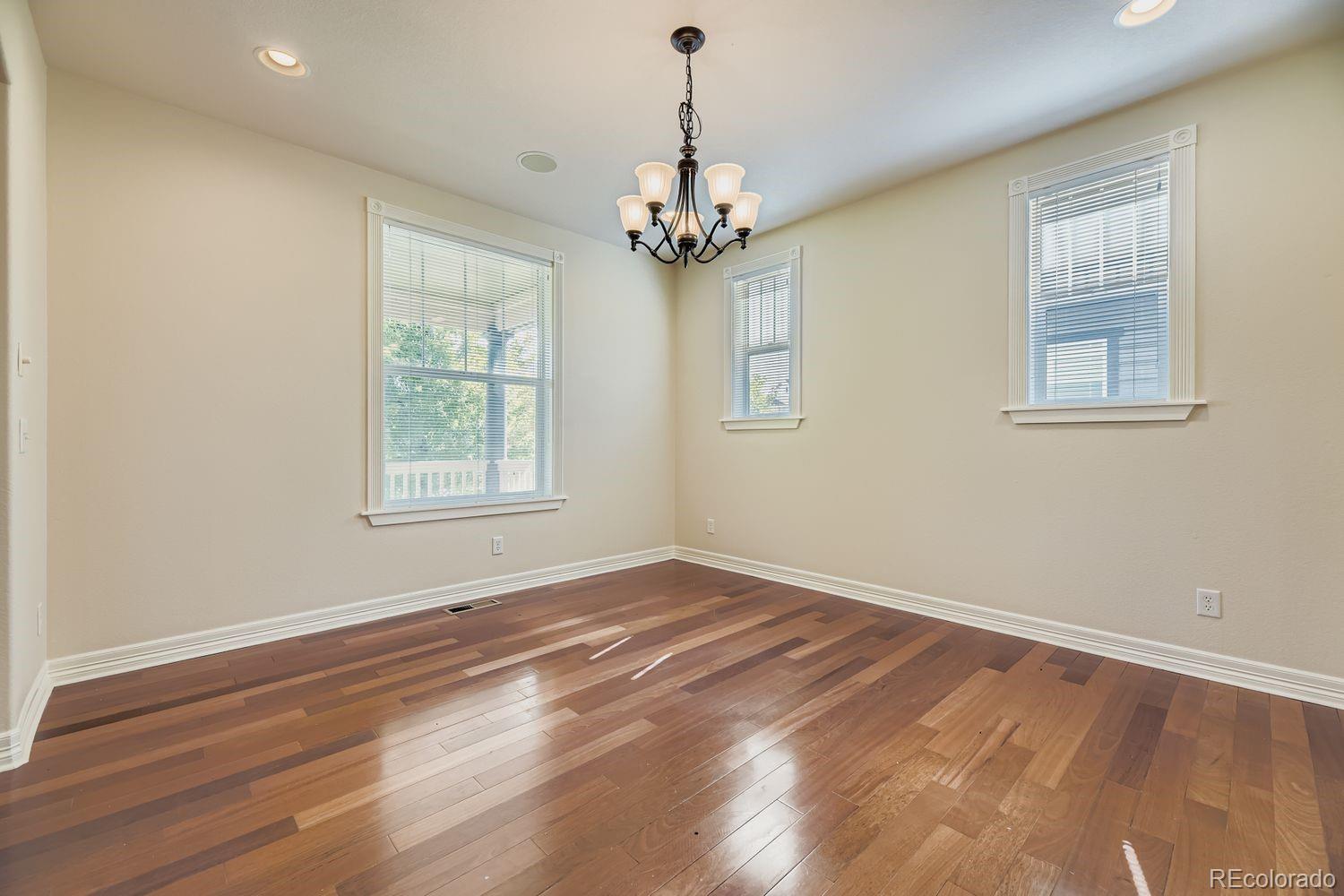 4927 South Addison Way Aurora, CO 80016 - Photo 11 of 24 a view of an empty room with a window