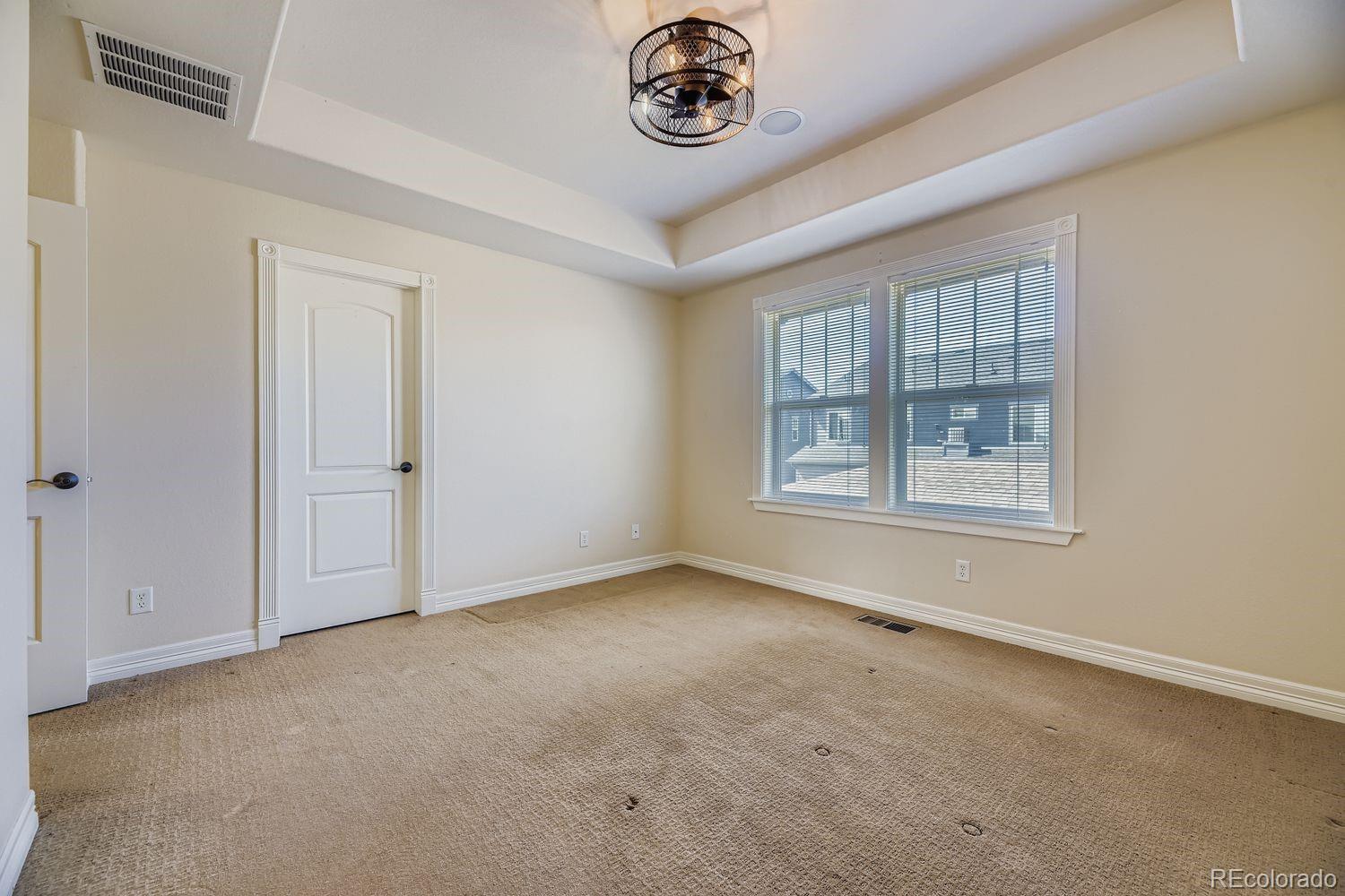 4927 South Addison Way Aurora, CO 80016 - Photo 15 of 24 an empty room with windows