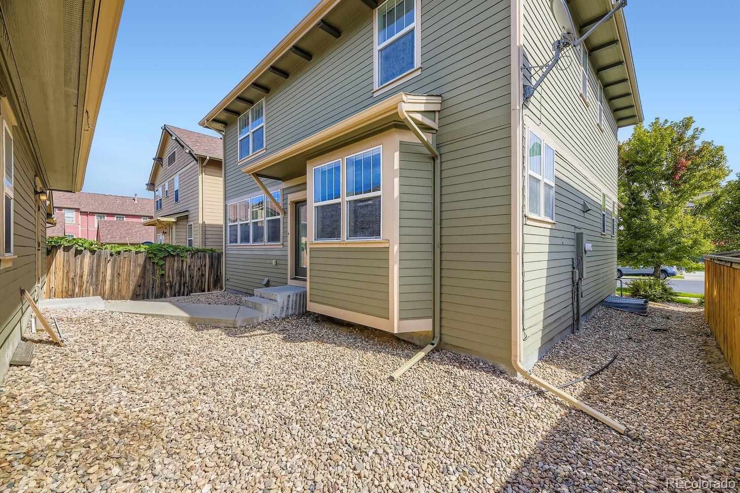 4927 South Addison Way Aurora, CO 80016 - Photo 23 of 24 a view of a house with a yard