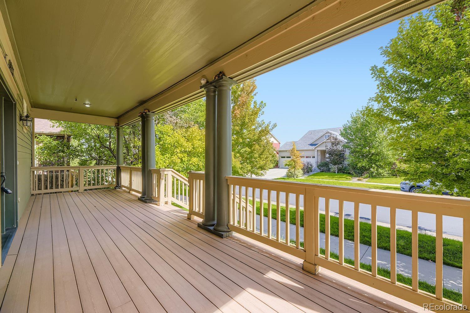 4927 South Addison Way Aurora, CO 80016 - Photo 3 of 24 a view of a balcony with wooden floor
