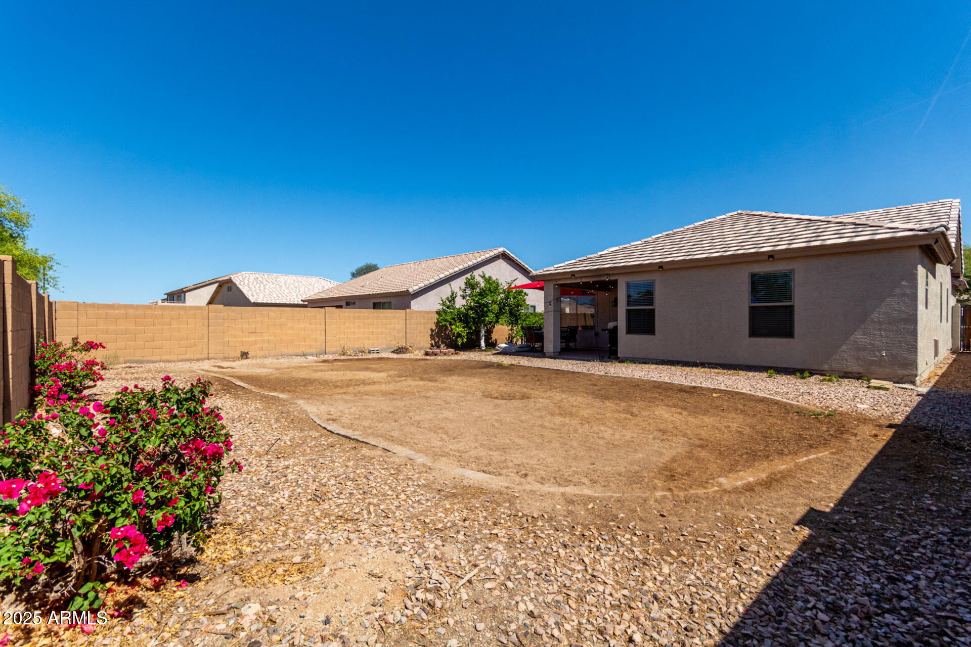 1634 East Harwell Road Phoenix, AZ 85042 - Photo 32 of 44 a view of a house with a yard