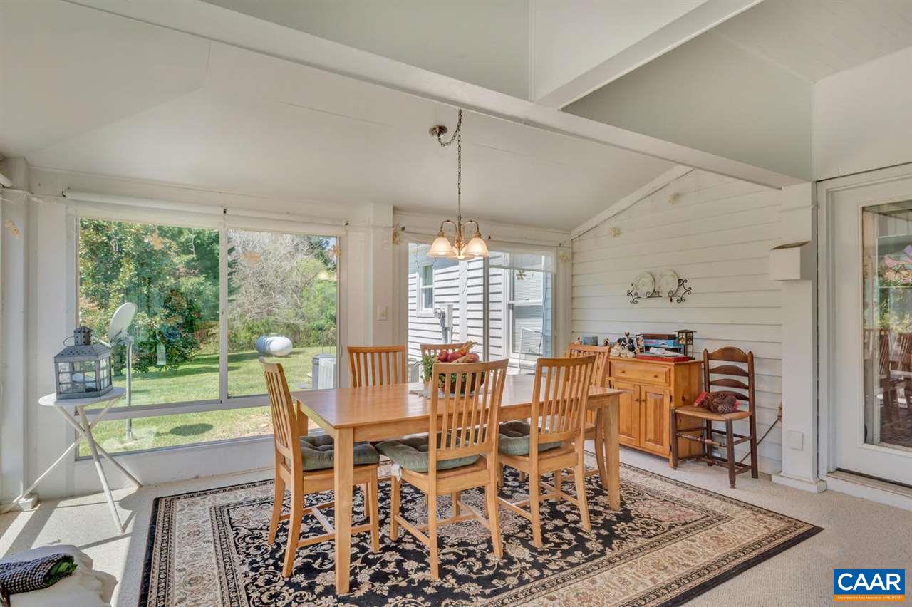 3826 Courthouse Road Palmyra, VA 22963 - Photo 36 of 50 a dining room with furniture a chandelier and wooden floor