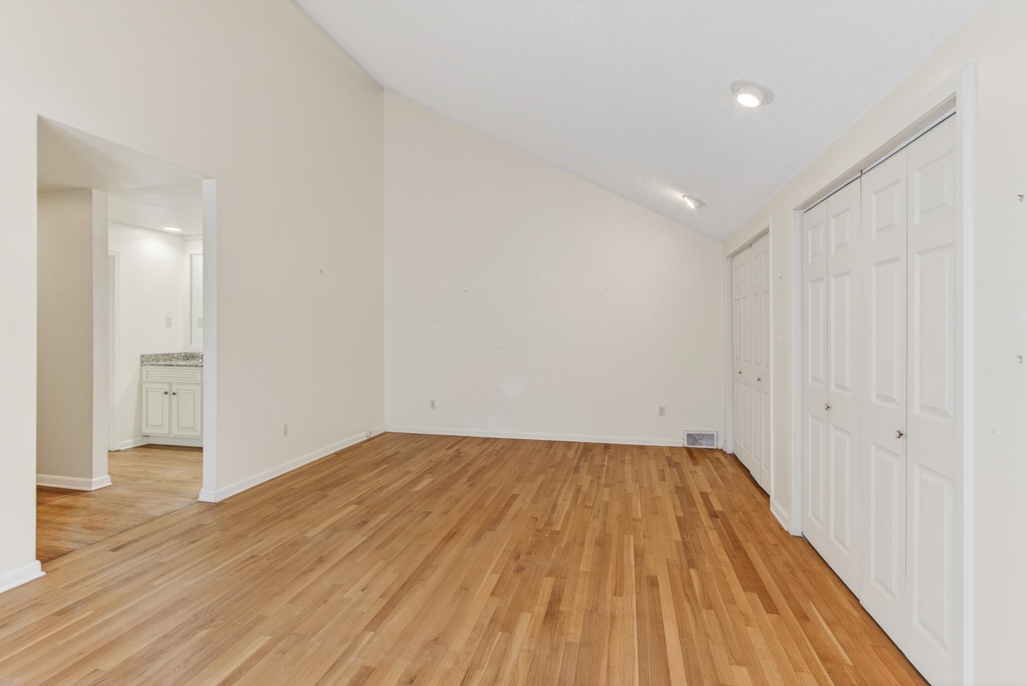 3121 Beechrun Drive Memphis, TN 38128 - Photo 23 of 40 View of the primary suite looking towards the private full bath and hallway that leads into this quiet space.