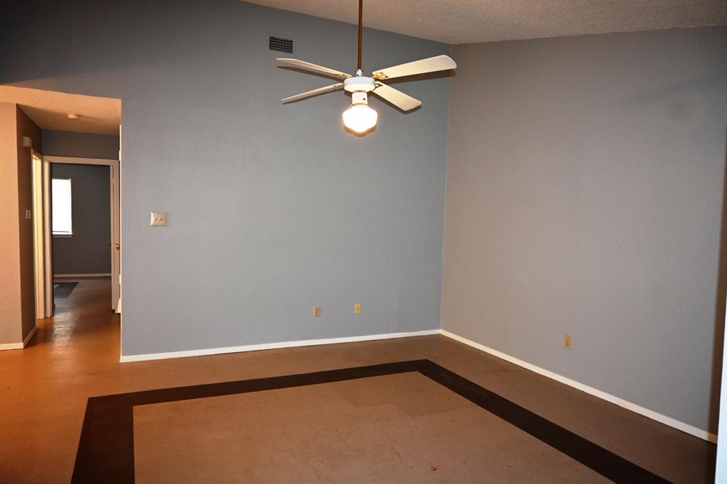 817 Lexington Road Elgin, TX 78621 - Photo 3 of 20 a view of a room with wooden floor